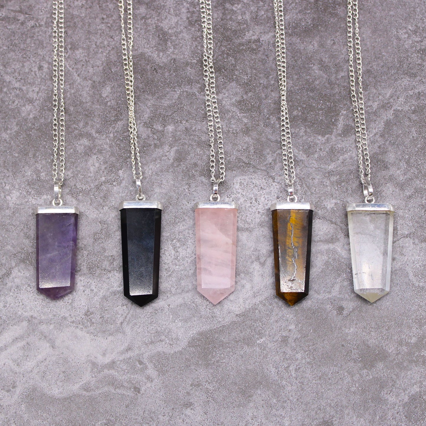 Pendant in the shape of a flat gemstone crystal – amethyst